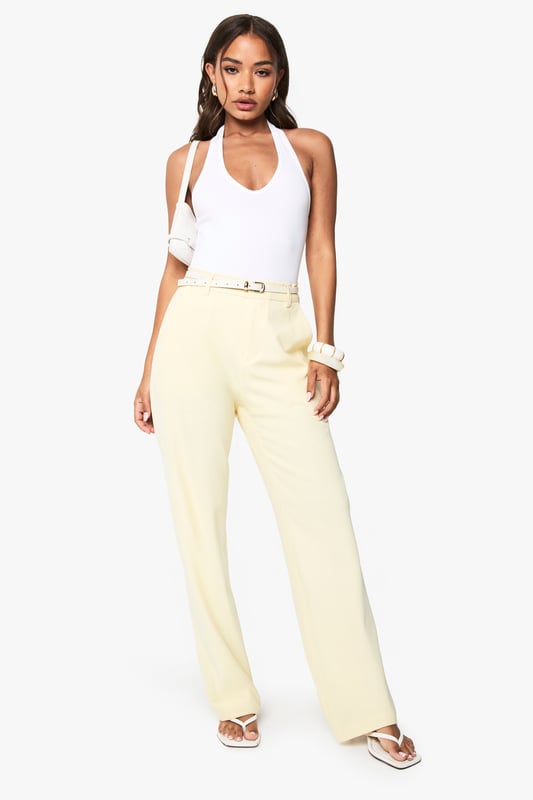 Slim-fit design with a flattering straight leg silhouette
        Sleek belt loops with a thin belt detail for a polished finish
        High-rise waistband for a figure-enhancing fit
        Smooth fabric with slight stretch for all-day comfort
        Clean-cut trouser styling perfect for versatile day-to-night wear
    
    These sophisticated straight-leg trousers from boohoo combine contemporary style with effortless versatility. The slim fit contours your silhouette whilst the straight leg offers a timeless appeal that works brilliantly for evening occasions. Style them as shown with a halterneck bodysuit and strappy heels for a chic night out ensemble, or pair with a cropped blazer and statement jewellery to command attention at after-work drinks. The clean lines and minimalist design make these trousers an essential foundation piece for your going-out wardrobe. Their subtle elegance allows for endless styling possibilities-dress them up with a sequined top for club nights or keep it understated with a silky camisole for cocktails with friends. These trousers transition seamlessly from early evening gatherings to late-night dancing.