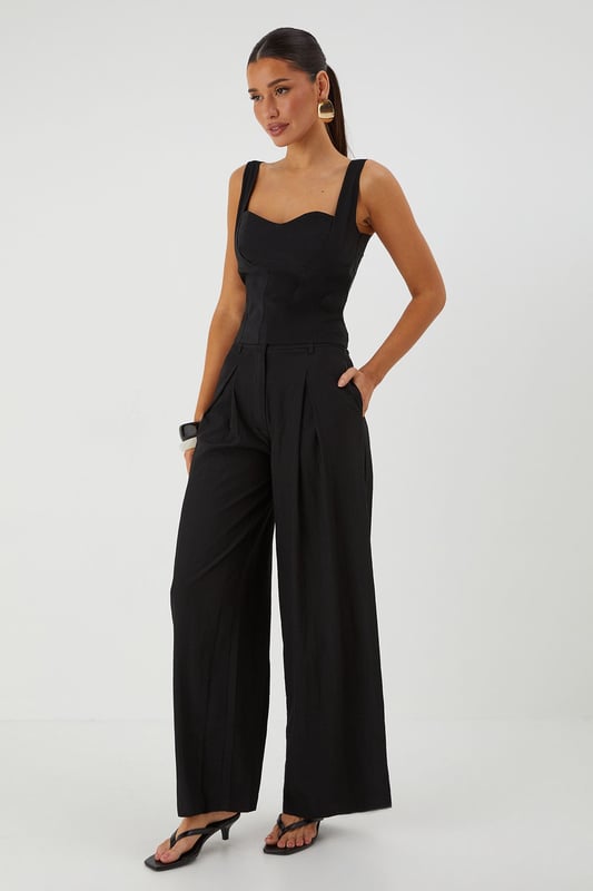Distinctive crinkle textured fabric adding visual interest and dimension
        Flattering wide leg silhouette that creates a dramatic flowing effect
        Practical side pockets for convenience and functionality
        Front pleating detail that adds structure and sophistication
        High-rise waistband designed to enhance your natural shape
    
    Make a statement with these eye-catching crinkle textured wide leg trousers from MissPap. The dramatic flowing silhouette creates movement with every step whilst the high-rise waistband accentuates your waist for a flattering fit. Style with a fitted crop top as shown for a balanced silhouette that's perfect for casual gatherings. For daytime outings, pair with a simple tee and trainers for an effortlessly cool look. When evening approaches, switch to a bodysuit and strappy heels to transform your ensemble. The versatile design works brilliantly for family gatherings or brunches with friends, whilst the textured fabric adds a distinctive touch that sets these trousers apart from basic styles. The practical side pockets add functionality to this fashion-forward piece that will quickly become a wardrobe favourite.