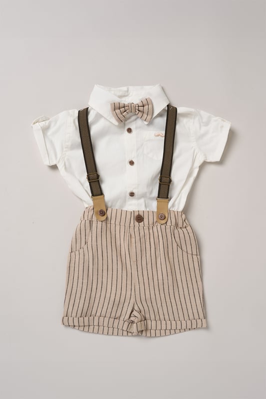 Dress your little one to impress with this delightful set from Little Gent. Featuring a shirt, bowtie, and shorts with attached braces. Perfect for special occasions or stylish outings, your little one will look effortlessly dapper and be ready to steal the spotlight!