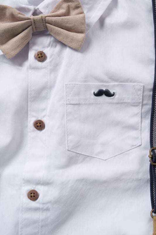 Dress your little one to impress with this delightful set from Little Gent. Featuring a shirt, bowtie, and shorts with attached braces. Perfect for special occasions or stylish outings, your little one will look effortlessly dapper and be ready to steal the spotlight!