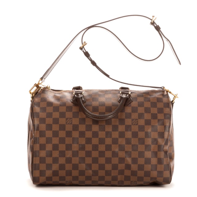 Louis Vuitton Tassen Speedy Bandouliere 35 Handtas in de Bruin Kalfsleer in de Gouden Messing  hardware. Het product is in In Perfecte Staat (AA).
  Afmetingen: 35x23x18 cm 
  Inclusief accessoires: Strap; Cadenas; Keys; Dustbag
      
  BrandCo Paris vindt zeldzame artikelen in de beste staat voor ongelooflijke prijzen. Het is de moeite waard om geduldig te zijn! Koop met vertrouwen: alle artikelen van BrandCo Paris worden zorgvuldig geselecteerd en geverifieerd door ons team van experts.

  Alle artikelen worden geleverd met een certificaat van echtheid en verpakt door BrandCo Paris.

  Classificatietabel voor de conditie van het artikel:

  N (als nieuw)
  AA (perfecte staat)
  A (uitstekende staat)
  AB (zeer goede staat)
  B (goede/redelijke staat)