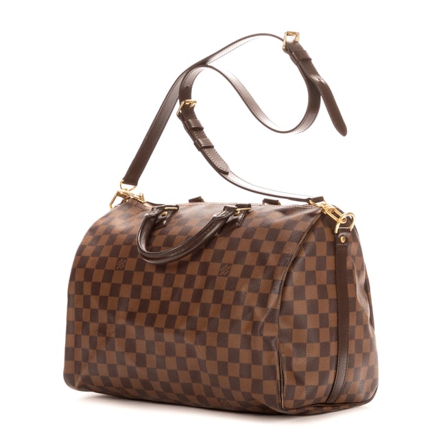 Louis Vuitton Tassen Speedy Bandouliere 35 Handtas in de Bruin Kalfsleer in de Gouden Messing  hardware. Het product is in In Perfecte Staat (AA).
  Afmetingen: 35x23x18 cm 
  Inclusief accessoires: Strap; Cadenas; Keys; Dustbag
      
  BrandCo Paris vindt zeldzame artikelen in de beste staat voor ongelooflijke prijzen. Het is de moeite waard om geduldig te zijn! Koop met vertrouwen: alle artikelen van BrandCo Paris worden zorgvuldig geselecteerd en geverifieerd door ons team van experts.

  Alle artikelen worden geleverd met een certificaat van echtheid en verpakt door BrandCo Paris.

  Classificatietabel voor de conditie van het artikel:

  N (als nieuw)
  AA (perfecte staat)
  A (uitstekende staat)
  AB (zeer goede staat)
  B (goede/redelijke staat)