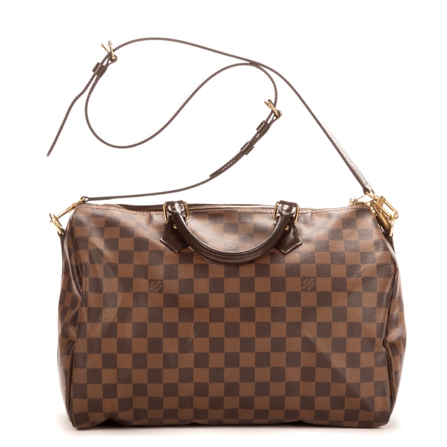 Louis Vuitton Tassen Speedy Bandouliere 35 Handtas in de Bruin Kalfsleer in de Gouden Messing  hardware. Het product is in In Perfecte Staat (AA).
  Afmetingen: 35x23x18 cm 
  Inclusief accessoires: Strap; Cadenas; Keys; Dustbag
      
  BrandCo Paris vindt zeldzame artikelen in de beste staat voor ongelooflijke prijzen. Het is de moeite waard om geduldig te zijn! Koop met vertrouwen: alle artikelen van BrandCo Paris worden zorgvuldig geselecteerd en geverifieerd door ons team van experts.

  Alle artikelen worden geleverd met een certificaat van echtheid en verpakt door BrandCo Paris.

  Classificatietabel voor de conditie van het artikel:

  N (als nieuw)
  AA (perfecte staat)
  A (uitstekende staat)
  AB (zeer goede staat)
  B (goede/redelijke staat)