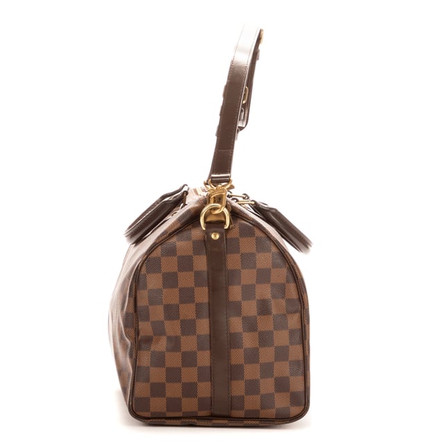 Louis Vuitton Tassen Speedy Bandouliere 35 Handtas in de Bruin Kalfsleer in de Gouden Messing  hardware. Het product is in In Perfecte Staat (AA).
  Afmetingen: 35x23x18 cm 
  Inclusief accessoires: Strap; Cadenas; Keys; Dustbag
      
  BrandCo Paris vindt zeldzame artikelen in de beste staat voor ongelooflijke prijzen. Het is de moeite waard om geduldig te zijn! Koop met vertrouwen: alle artikelen van BrandCo Paris worden zorgvuldig geselecteerd en geverifieerd door ons team van experts.

  Alle artikelen worden geleverd met een certificaat van echtheid en verpakt door BrandCo Paris.

  Classificatietabel voor de conditie van het artikel:

  N (als nieuw)
  AA (perfecte staat)
  A (uitstekende staat)
  AB (zeer goede staat)
  B (goede/redelijke staat)