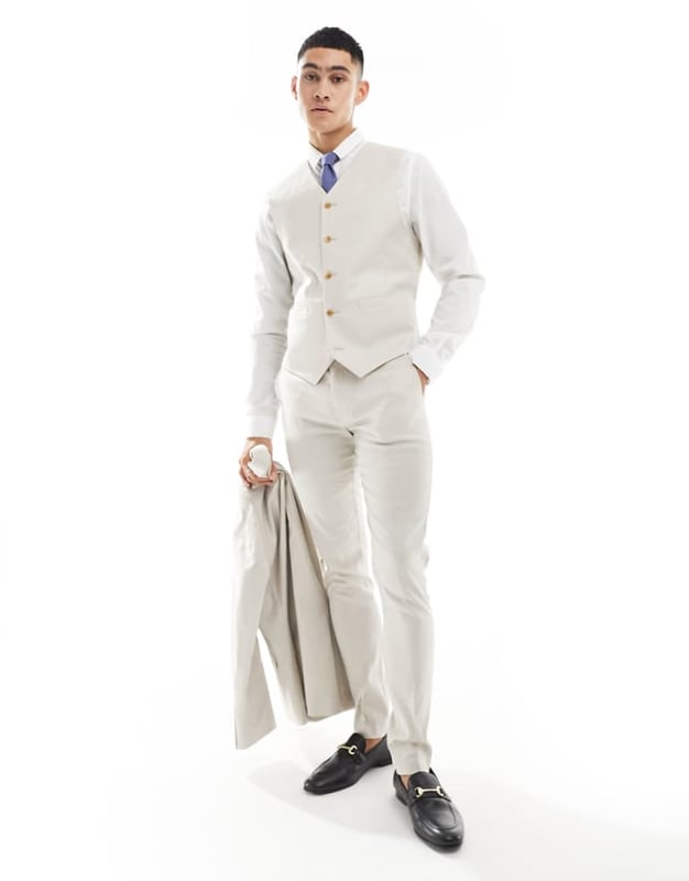 Suits by ASOS DESIGN Do the smart thing V-neck Button placket Pocket details Contrast back with an adjustable cinch Skinny fitSold By: Asos