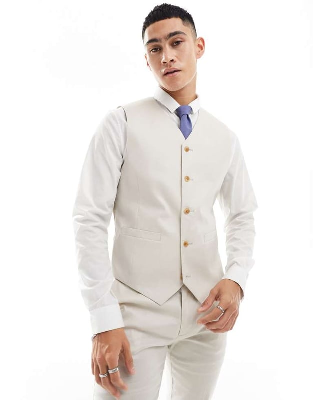 Suits by ASOS DESIGN Do the smart thing V-neck Button placket Pocket details Contrast back with an adjustable cinch Skinny fitSold By: Asos