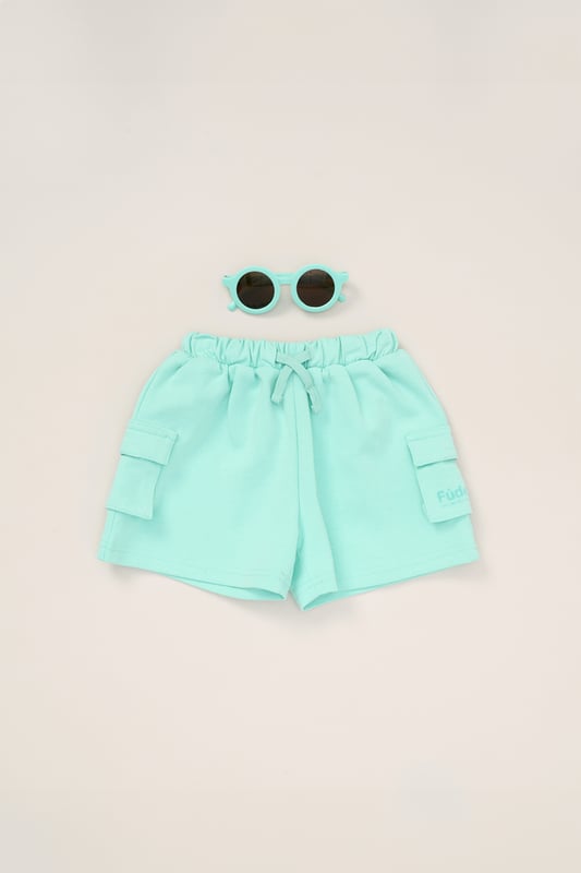 Keep your little one on trend this season with this 3-piece outfit set from Fudo. The set includes a heavyweight oversized T-shirt with a tonal chest logo, matching shorts with two large side pockets and a drawstring waist, plus stylish sunglasses. A comfy, trendy set that blends fashion and function for your little one’s wardrobe.