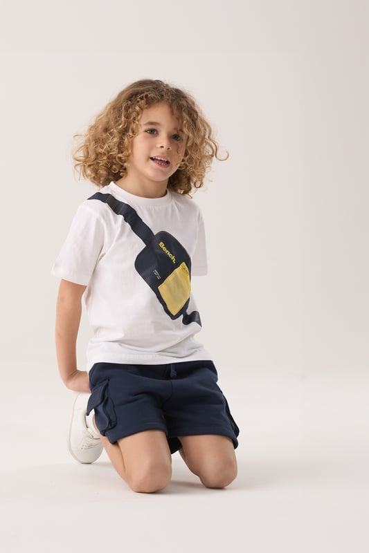 This Bench 2-piece set includes a breathable cotton t-shirt and comfy brushed sweat shorts – perfect for everyday adventures. The t-shirt features a fun printed bag graphic across the chest, complete with a zip detail for added style. The shorts have a soft elasticated waistband with a cotton drawcord for an easy, adjustable fit. A go-to outfit that blends comfort and playful design for active days.