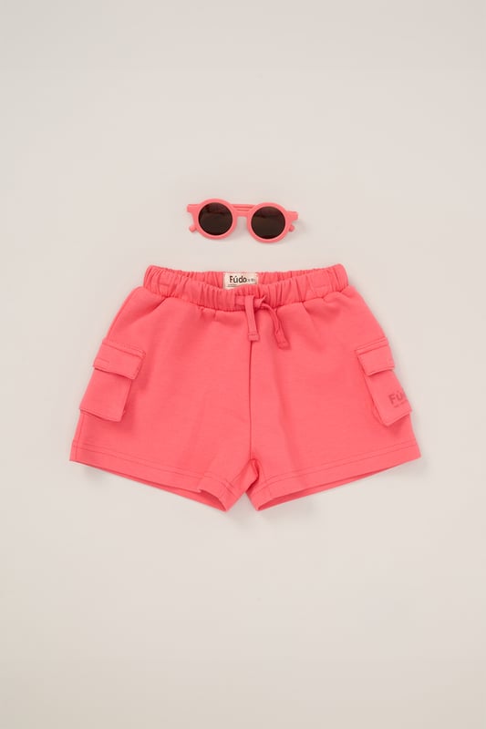 Keep your little one on trend this season with this 3-piece outfit set from Fudo. The set includes a heavyweight oversized T-shirt with a tonal chest logo, matching shorts with two large side pockets and a drawstring waist, plus stylish sunglasses. A comfy, trendy set that blends fashion and function for your little one’s wardrobe.