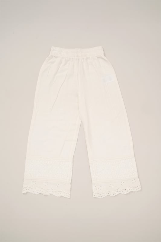 This co-ord set by Miss is a stylish blend of comfort and style. The top features floaty sleeves, while the wide-leg trousers bring effortless elegance. Both pieces are adorned with broderie and crochet panel detailing, making it a perfect choice for sunny days and special outings.