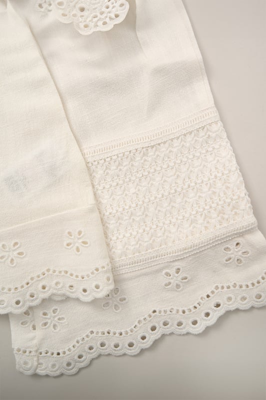 This co-ord set by Miss is a stylish blend of comfort and style. The top features floaty sleeves, while the wide-leg trousers bring effortless elegance. Both pieces are adorned with broderie and crochet panel detailing, making it a perfect choice for sunny days and special outings.