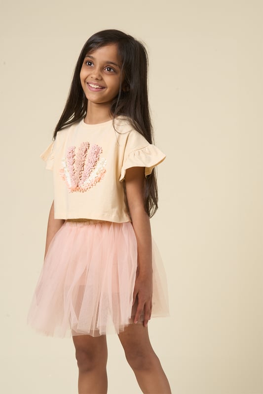This cute set by Miss features a printed T-shirt with playful ruffle sleeves and a matching floaty skirt. Designed for twirling, exploring, and everything in between, it’s the perfect outfit for carefree days and fun-filled adventures.