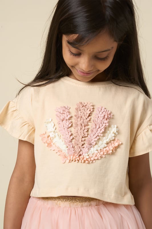 This cute set by Miss features a printed T-shirt with playful ruffle sleeves and a matching floaty skirt. Designed for twirling, exploring, and everything in between, it’s the perfect outfit for carefree days and fun-filled adventures.