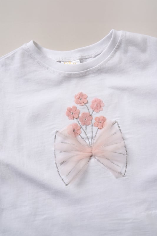 This cute set by Miss features a printed T-shirt with playful ruffle sleeves and a matching floaty skirt. Designed for twirling, exploring, and everything in between, it’s the perfect outfit for carefree days and fun-filled adventures.