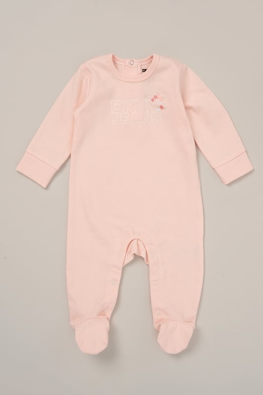 Soft, simple and snuggly. This all-in-one from DKNY is crafted from 100% cotton for gentle comfort against delicate skin. With easy fastenings and a cosy feel, it’s a perfect everyday essential for little ones on the move or at rest. Comes complete with a matching comforter for added snuggles.