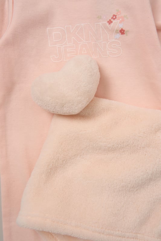 Soft, simple and snuggly. This all-in-one from DKNY is crafted from 100% cotton for gentle comfort against delicate skin. With easy fastenings and a cosy feel, it’s a perfect everyday essential for little ones on the move or at rest. Comes complete with a matching comforter for added snuggles.
