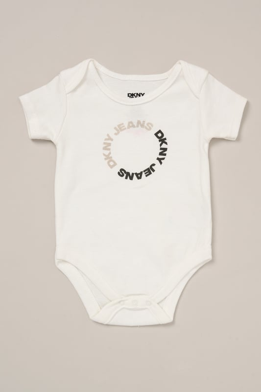 Designed for sunny days and busy babies, this 3-piece set from DKNY includes a cotton bodysuit, comfy shorts and a coordinating bib. A great go-to for playdates and mealtimes, it offers soft comfort and cute style in one. 100% cotton.