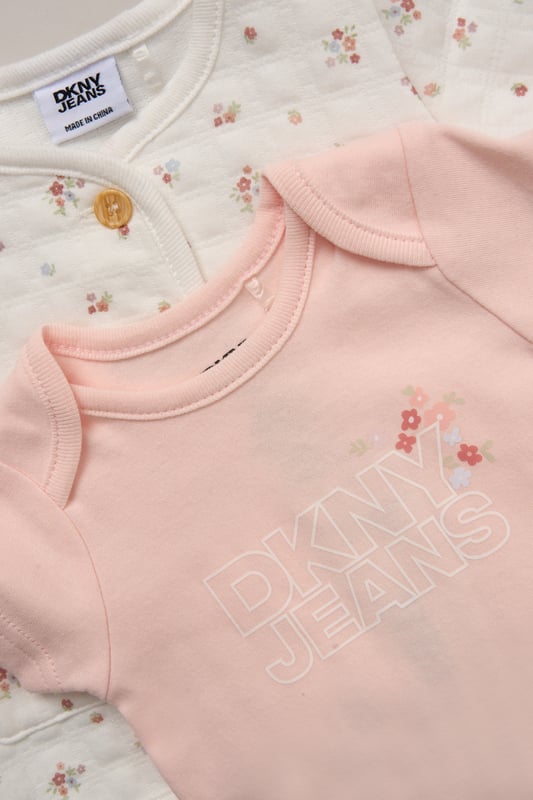This soft and breathable 3-piece set from DKNY includes comfy cotton blend trousers, a short-sleeve bodysuit, and a coordinating cardigan - perfect for layering through Spring and Summer. Whether you're heading out or staying in, it’s a versatile everyday outfit for little ones.