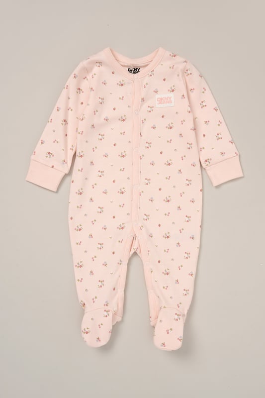 This adorable 2-piece set from DKNY includes a soft cotton all-in-one and a matching hat to keep little ones comfy and covered. Lightweight and breathable, it's perfect for warm spring days or summer naps. An easy all-day outfit for play, cuddles, and everything in between.