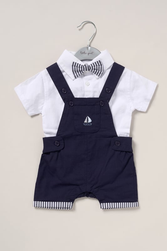 Dress your little one in style with this adorable bodysuit shirt and dungarees set by Little Gent. Complete with a charming bowtie, this outfit is perfect for any occasion. Designed with playful charm and practicality in mind, it’s an ideal choice to keep your little one looking dapper all day long.