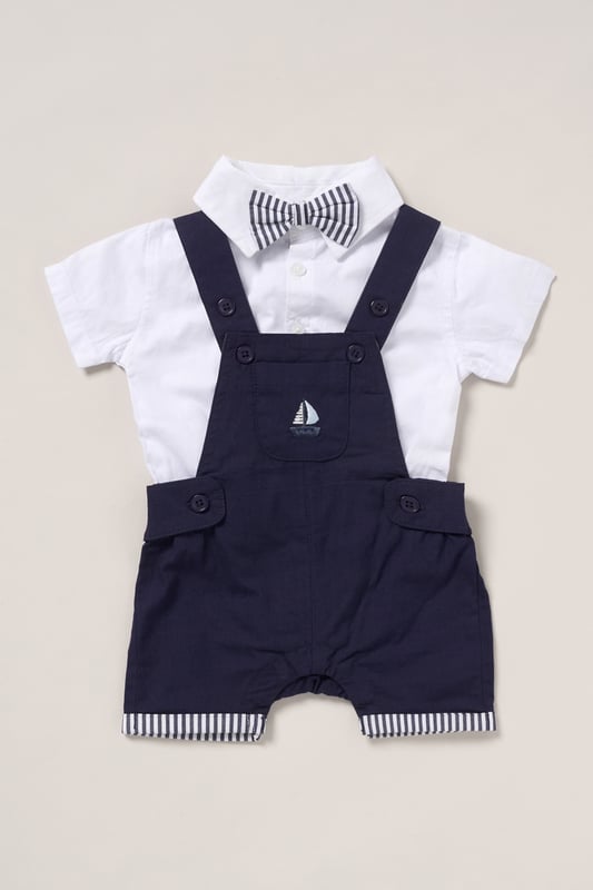 Dress your little one in style with this adorable bodysuit shirt and dungarees set by Little Gent. Complete with a charming bowtie, this outfit is perfect for any occasion. Designed with playful charm and practicality in mind, it’s an ideal choice to keep your little one looking dapper all day long.