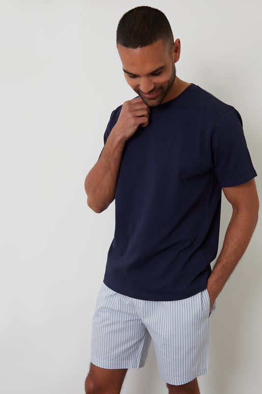 Experience ultimate comfort with this short pyjama set from Threadbare, designed for restful nights and easy lounging. Cut in a regular fit, this pyjama set is perfect for year round comfort. This set includes a short sleeve popcorn textured crew neck top with Threadbare embroidery on the chest and striped cotton poplin shorts with an elasticated waistband, drawcords and two side pockets. Ideal for lounging or winding down, this is a cosy and stylish addition to your sleepwear wardrobe.
