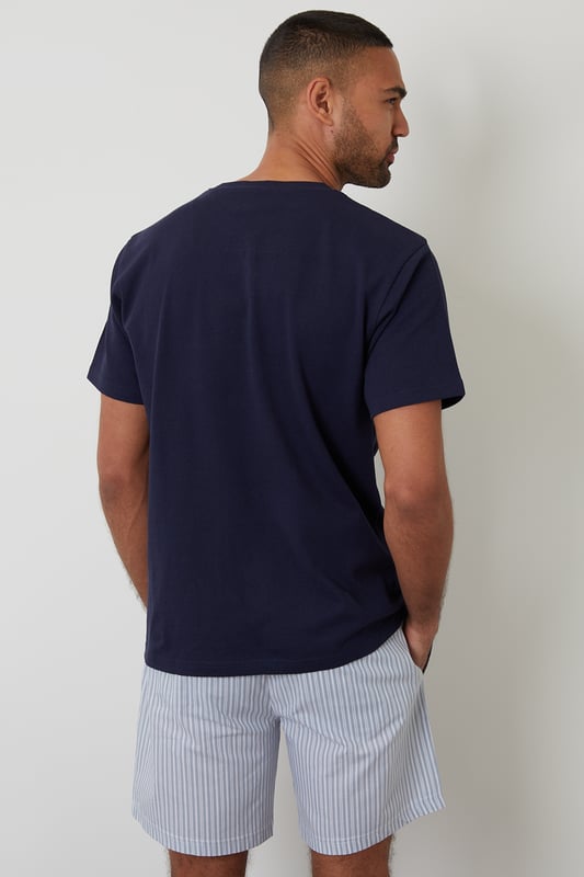 Experience ultimate comfort with this short pyjama set from Threadbare, designed for restful nights and easy lounging. Cut in a regular fit, this pyjama set is perfect for year round comfort. This set includes a short sleeve popcorn textured crew neck top with Threadbare embroidery on the chest and striped cotton poplin shorts with an elasticated waistband, drawcords and two side pockets. Ideal for lounging or winding down, this is a cosy and stylish addition to your sleepwear wardrobe.