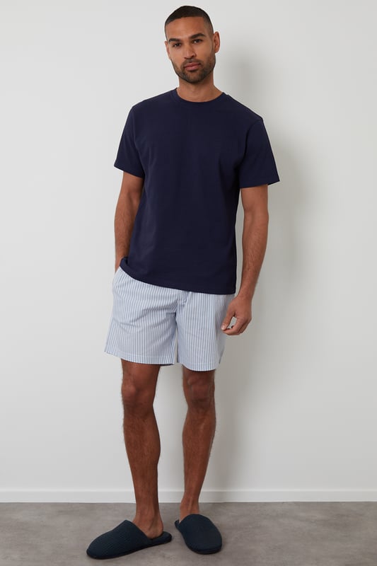 Experience ultimate comfort with this short pyjama set from Threadbare, designed for restful nights and easy lounging. Cut in a regular fit, this pyjama set is perfect for year round comfort. This set includes a short sleeve popcorn textured crew neck top with Threadbare embroidery on the chest and striped cotton poplin shorts with an elasticated waistband, drawcords and two side pockets. Ideal for lounging or winding down, this is a cosy and stylish addition to your sleepwear wardrobe.