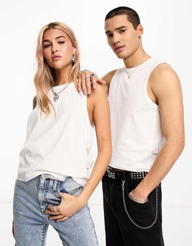 Tops by Calvin Klein Jeans  Round neck Sleeveless style Logo tab to side Regular fit Unisex styleSold By: Asos