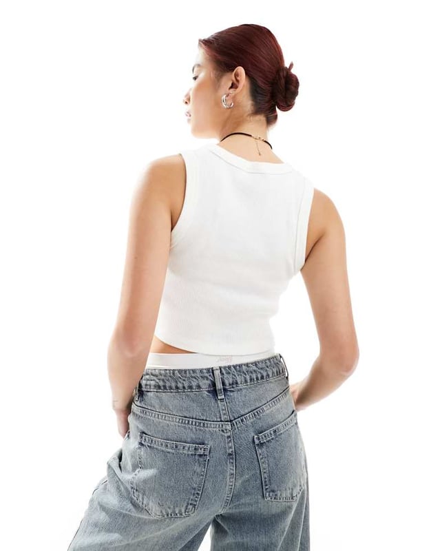 Tops by Vans Next stop: checkout Plain design Scoop neck Cropped length Racer back Slim fitSold By: Asos