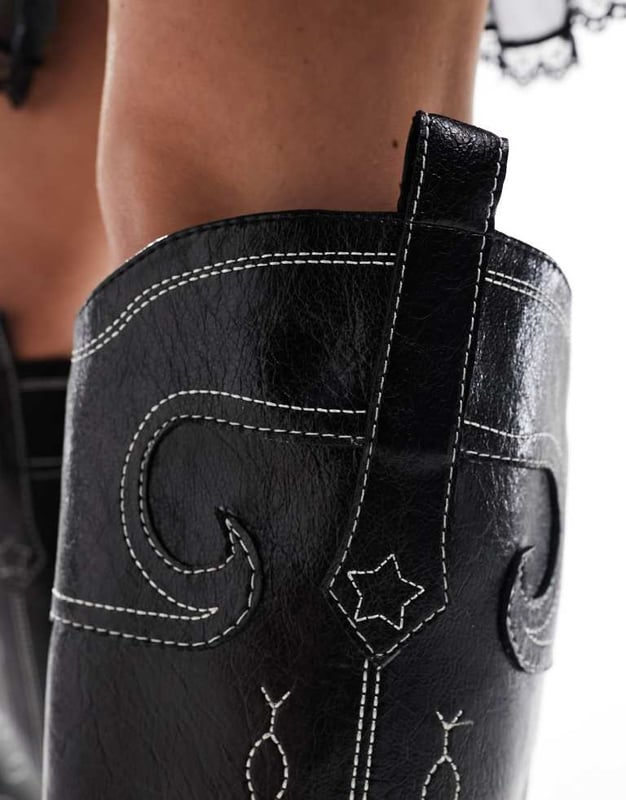 Shoes by Public Desire Talk about yeehaw Western design Pull tabs for easy entry Pointed toe Low block heelSold By: Asos