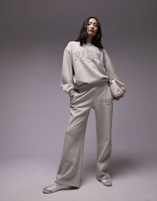 Trousers & Leggings by Topshop Welcome to the next phase of Topshop Sweatshirt sold separately Elasticated waistband Side pockets Text embroidery Straight fitSold By: Asos