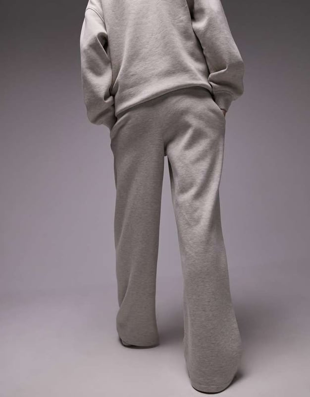 Trousers & Leggings by Topshop Welcome to the next phase of Topshop Sweatshirt sold separately Elasticated waistband Side pockets Text embroidery Straight fitSold By: Asos