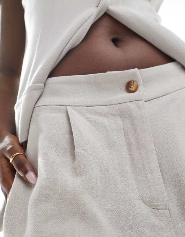 Shorts by In The Style Part of a co-ord set Top sold separately High rise Concealed fly Side pockets Regular fitSold By: Asos