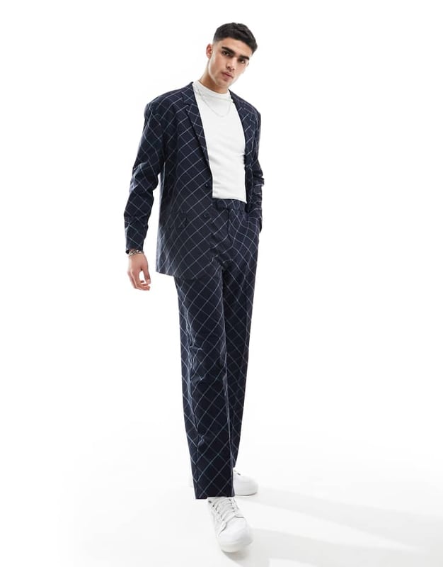 ASOS DESIGN relaxed bias cut check suit jacket in navy windowpane Suits by ASOS DESIGN Suits you Notch lapels Single-breasted style Two-button fastening Pocket details Relaxed fitSold By: Asos