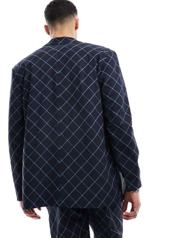 ASOS DESIGN relaxed bias cut check suit jacket in navy windowpane Suits by ASOS DESIGN Suits you Notch lapels Single-breasted style Two-button fastening Pocket details Relaxed fitSold By: Asos