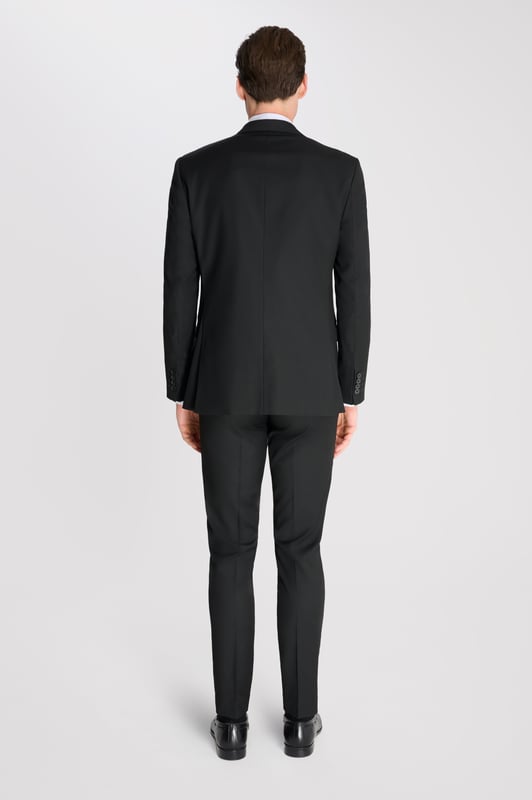 3-Piece Suit Set by Carter & Jones
Elevate your formal wardrobe with the 3-Piece Suit Set by Carter & Jones, designed for the discerning gentleman who values both style and sophistication. This suit set includes a jacket, trousers, and waistcoat, each featuring those classic details that ensure you stand out in any setting.

Jacket: A 2-Button Single Breasted design with a classic cut that exudes modern elegance. The jacket is equipped with two back vents for added comfort and ease of movement. Finished with a distinctive Contrasting Lapel Pin for a touch of personality, the jacket also offers 2 Flap Pockets, a chest pocket, and multiple internal pockets for practicality. Fully lined for a premium finish.

Trousers: Pleated trousers that offer a refined silhouette with a Hook and Bar Closure, combining comfort with style for an impeccable fit.

Waistcoat: A statement piece, featuring a Cinch Belt for a tailored fit, Silken Lining, and a Button Closure for that perfect polished look.

Slim Fit 

Main Fabric 68% Polyester 29% Viscose 3% Elastane.

Lining 100% Polyester.

Dry Clean Only.

This suit comes nested, meaning the trousers will have a 6 inch difference to the jacket (eg.: Jacket & Waistcoat - 38R | Trousers - 32R).

This 3-piece suit set is the ideal choice for weddings, business events, or any occasion that requires a sharp, sophisticated appearance. Carter & Jones delivers exceptional craftsmanship, ensuring you look your best with every wear.