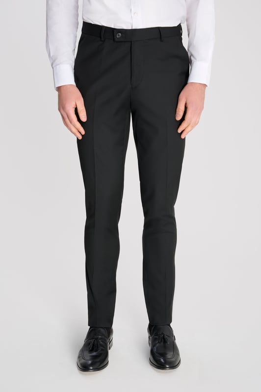 3-Piece Suit Set by Carter & Jones
Elevate your formal wardrobe with the 3-Piece Suit Set by Carter & Jones, designed for the discerning gentleman who values both style and sophistication. This suit set includes a jacket, trousers, and waistcoat, each featuring those classic details that ensure you stand out in any setting.

Jacket: A 2-Button Single Breasted design with a classic cut that exudes modern elegance. The jacket is equipped with two back vents for added comfort and ease of movement. Finished with a distinctive Contrasting Lapel Pin for a touch of personality, the jacket also offers 2 Flap Pockets, a chest pocket, and multiple internal pockets for practicality. Fully lined for a premium finish.

Trousers: Pleated trousers that offer a refined silhouette with a Hook and Bar Closure, combining comfort with style for an impeccable fit.

Waistcoat: A statement piece, featuring a Cinch Belt for a tailored fit, Silken Lining, and a Button Closure for that perfect polished look.

Slim Fit 

Main Fabric 68% Polyester 29% Viscose 3% Elastane.

Lining 100% Polyester.

Dry Clean Only.

This suit comes nested, meaning the trousers will have a 6 inch difference to the jacket (eg.: Jacket & Waistcoat - 38R | Trousers - 32R).

This 3-piece suit set is the ideal choice for weddings, business events, or any occasion that requires a sharp, sophisticated appearance. Carter & Jones delivers exceptional craftsmanship, ensuring you look your best with every wear.