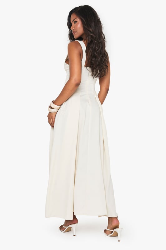 Textured crepe fabric with structured skater silhouette for added movement and flair
        Plunging V-neckline creates a striking focal point perfect for evening occasions
        Sleeveless design with elegant wide straps for comfortable support
        Maxi length with flowing skirt that gracefully skims the floor
        Pleated detailing at waist creates a flattering, feminine shape
    
    Make a statement at your next night out with this show-stopping skater maxidress from Boohoo. The textured crepe fabric adds subtle dimension while the plunging neckline creates a bold, confident look that demands attention. Style with strappy heels and statement bangles as seen on our model for a club-ready ensemble, or dress it up with metallic accessories and a sleek clutch for cocktails with friends. The flowing maxi silhouette moves beautifully as you dance, while the structured bodice provides a flattering fit that hugs in all the right places. This versatile piece transitions effortlessly from summer soires to autumn events with the addition of a cropped jacket. Perfect for those who want to combine comfort with head-turning style for urban nightlife adventures.