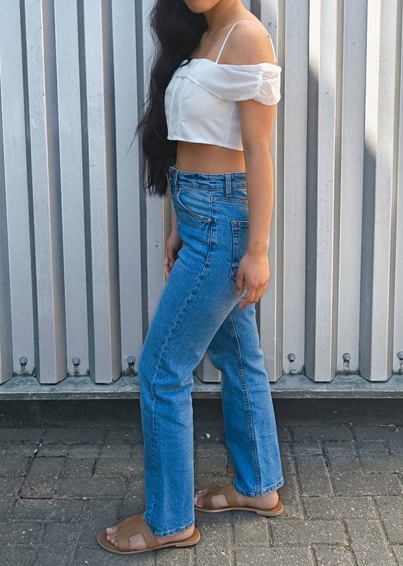 Elevate your casual style with our White Bow Detail Off Shoulder Top. This eye-catching piece features a flattering off-shoulder design with charming bow accents that add a touch of feminine flair. Perfect for summer days or evening outings, this versatile top pairs effortlessly with jeans, shorts, or skirts for a comfortable yet bold look that turns heads.