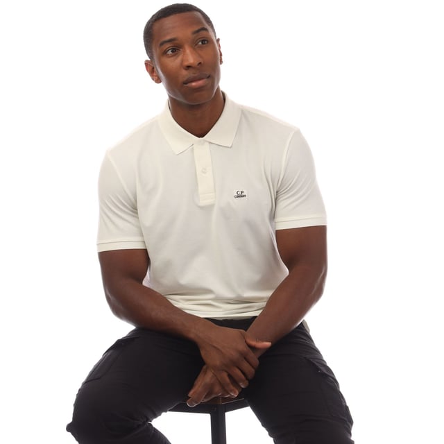 Mens C.P. Company Stretch Piquet Logo Polo Shirt in white.- Polo collar.- Short sleeves with ribbed cuffs.- Two button fastened placket.- Logo patch at the chest.- Split hem to the sides.- Straight hem.- 95% Cotton  5% Elastane.- Ref: 18CMPL065A103