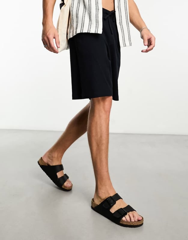 Shorts by ASOS DESIGN Short listed Waffle-textured finish Elasticated drawstring waist Functional pockets Oversized fitSold By: Asos