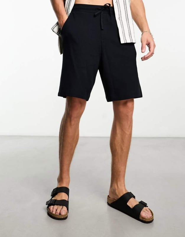 Shorts by ASOS DESIGN Short listed Waffle-textured finish Elasticated drawstring waist Functional pockets Oversized fitSold By: Asos