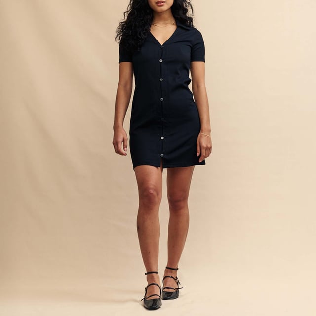 Women's Nobodys Child Reed Jersey Mini Dress. A summer dress that’ll go from 9am to 5pm. This classic black mini is lightly textured for a crinkled feel, you don’t even have to iron it. A button-up front is topped off with a collar. Wear yours in the week with a touch of gold jewellery.- Collar Short sleeves.- Button front.- Designed for a close cut. Material: 99% Polyester (Recycled), 1% Elastane. Ref: D240772BLK.