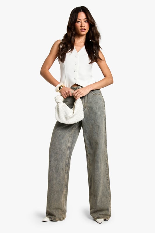 Sleek V-neck design for a flattering neckline
        Boxy fit for a contemporary silhouette
        Button-front closure adds a classic touch
        Versatile sleeveless style perfect for layering
        Cropped length ideal for high-waisted bottoms
    
    Embrace effortless chic with this essential waistcoat, a must-have addition to your wardrobe. The boxy fit offers a modern twist on a timeless classic, while the V-neck design creates a flattering frame. Style this versatile piece for a range of casual occasions, from family gatherings to laid-back brunches with friends. Layer it over a crisp white shirt and pair with wide-leg trousers for a polished look, or throw it on over a simple tee with your favourite jeans for an effortlessly cool ensemble. The cropped length works beautifully with high-waisted bottoms, creating a balanced silhouette. Accessorise with delicate gold jewellery and a small handbag to complete your look. This waistcoat is the perfect blend of comfort and style, ensuring you'll reach for it time and time again.