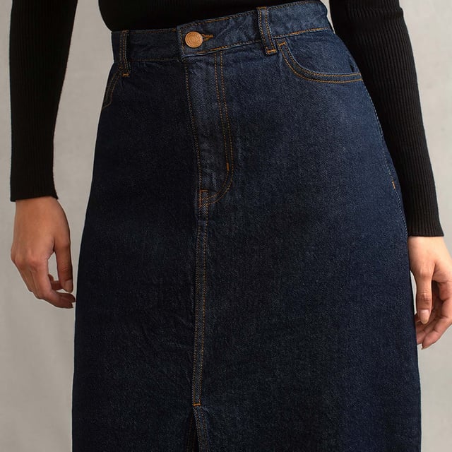 Women's Nobodys Child Denim Column Skirt. This season the iconic denim skirt has got a little longer and we’re in love. Cut to a midi column shape, this stylish new number is made in an inky indigo blue. Don’t miss the subtle NC embroidery stitched on the back pocket. Wear it with everything from tank tops to super soft knits.- Front and back pockets.- Belt loops.- Classic five pocket style.- Tobacco coloured stitching.- Copper-tone NC button.- Zip fly.- Centre slit. Material: 99% Organic Cotton, 1% Elastane. Ref: B231982BLU.