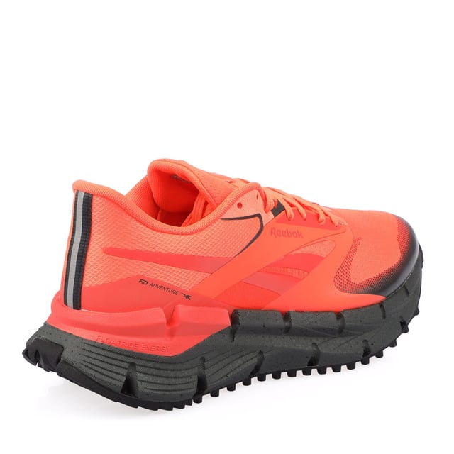Reebok FloatZig Adventure 1 Trainers in orange black.- Textile upper.- Lace closure.- Floatride Energy Foam.- Textile lining.- High traction rubber outsole.- Ref.: 100212127