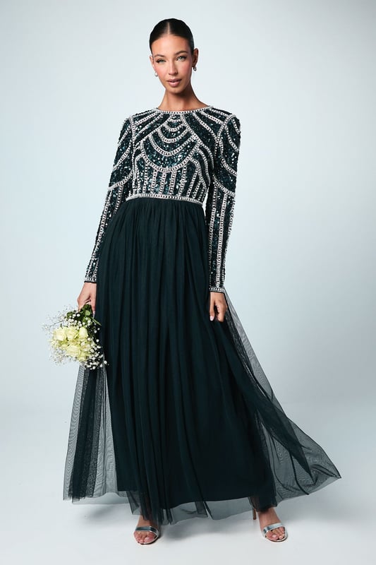 If a showstopping bridesmaid gown is what you're looking for, you're in the right place. Featuring a bodice swathed in dazzling sequins that glimmer in an art-deco pattern under the light, this design is finished by a delicate tulle skirt, adding to the sophisticated, old-time glamour aesthetic. Made from embellished sequins: exquisitely ornated with hand-sewn beads, this luxurious fabrication has a heavyweight feel, encasing your figure for a sculptural silhouette. Every unique pattern is created exclusively in-house by a team of artists. Level of stretch: none. This dress fastens with a rear concealed zip.This style is part of the Coast Honoured Collection, a dedicated range of never out-of-stock, bridesmaid dresses guaranteed to favour every member of your bridal party. Available in a selection of bestselling colour palettes, perfect for mix-and-match groups.