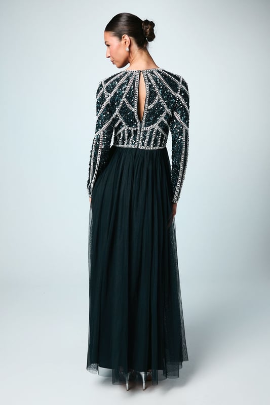 If a showstopping bridesmaid gown is what you're looking for, you're in the right place. Featuring a bodice swathed in dazzling sequins that glimmer in an art-deco pattern under the light, this design is finished by a delicate tulle skirt, adding to the sophisticated, old-time glamour aesthetic. Made from embellished sequins: exquisitely ornated with hand-sewn beads, this luxurious fabrication has a heavyweight feel, encasing your figure for a sculptural silhouette. Every unique pattern is created exclusively in-house by a team of artists. Level of stretch: none. This dress fastens with a rear concealed zip.This style is part of the Coast Honoured Collection, a dedicated range of never out-of-stock, bridesmaid dresses guaranteed to favour every member of your bridal party. Available in a selection of bestselling colour palettes, perfect for mix-and-match groups.
