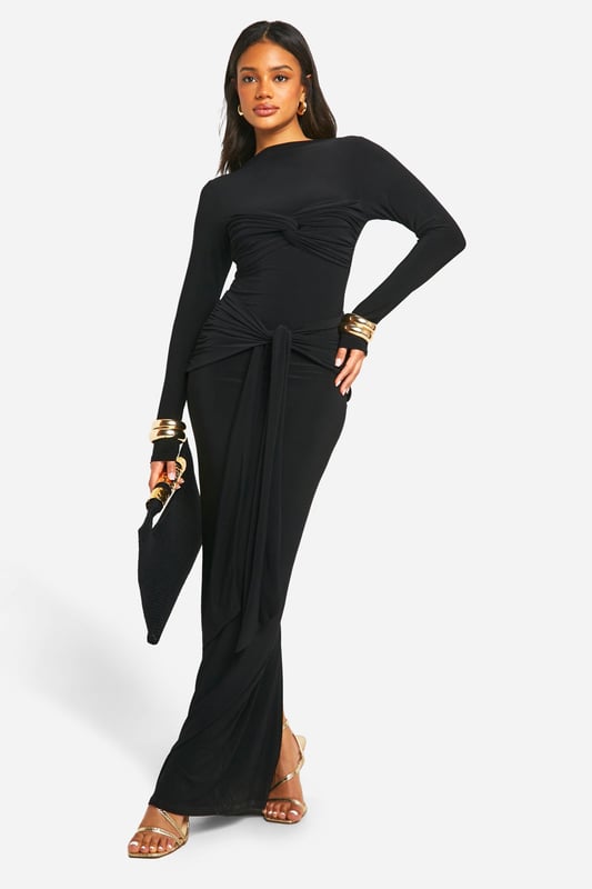Striking twist-detail at the waist for a flattering silhouette
        Floor-sweeping maxi length for dramatic elegance
        Long sleeves and slash neckline offer versatile styling options
        Figure-hugging ITY jersey fabric with gentle stretch
        Gathered design creates a luxurious drape effect
    
    Make a lasting impression with this show-stopping maxi dress from Boohoo. The eye-catching twist detail at the waist creates a stunning focal point, accentuating your curves and adding a touch of sophistication. Perfect for those nights out when you want to turn heads, this dress effortlessly combines comfort with high fashion. Style it with strappy heels and statement earrings for a glamorous club look, or dress it down with metallic flats and a clutch for drinks with the girls. The versatile slash neckline allows for various jewellery options, while the long sleeves provide coverage without compromising on style. Whether you're dancing the night away or enjoying cocktails at a rooftop bar, this dress will ensure you're the centre of attention in all the right ways.